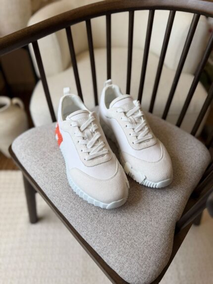 Hermès Bouncing sneakers, featuring a white leather and suede design