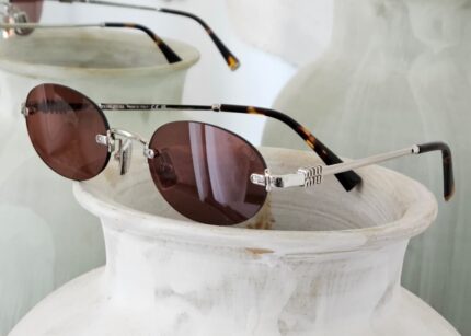 Miu Miu M169 Oval Rimless Sunglasses